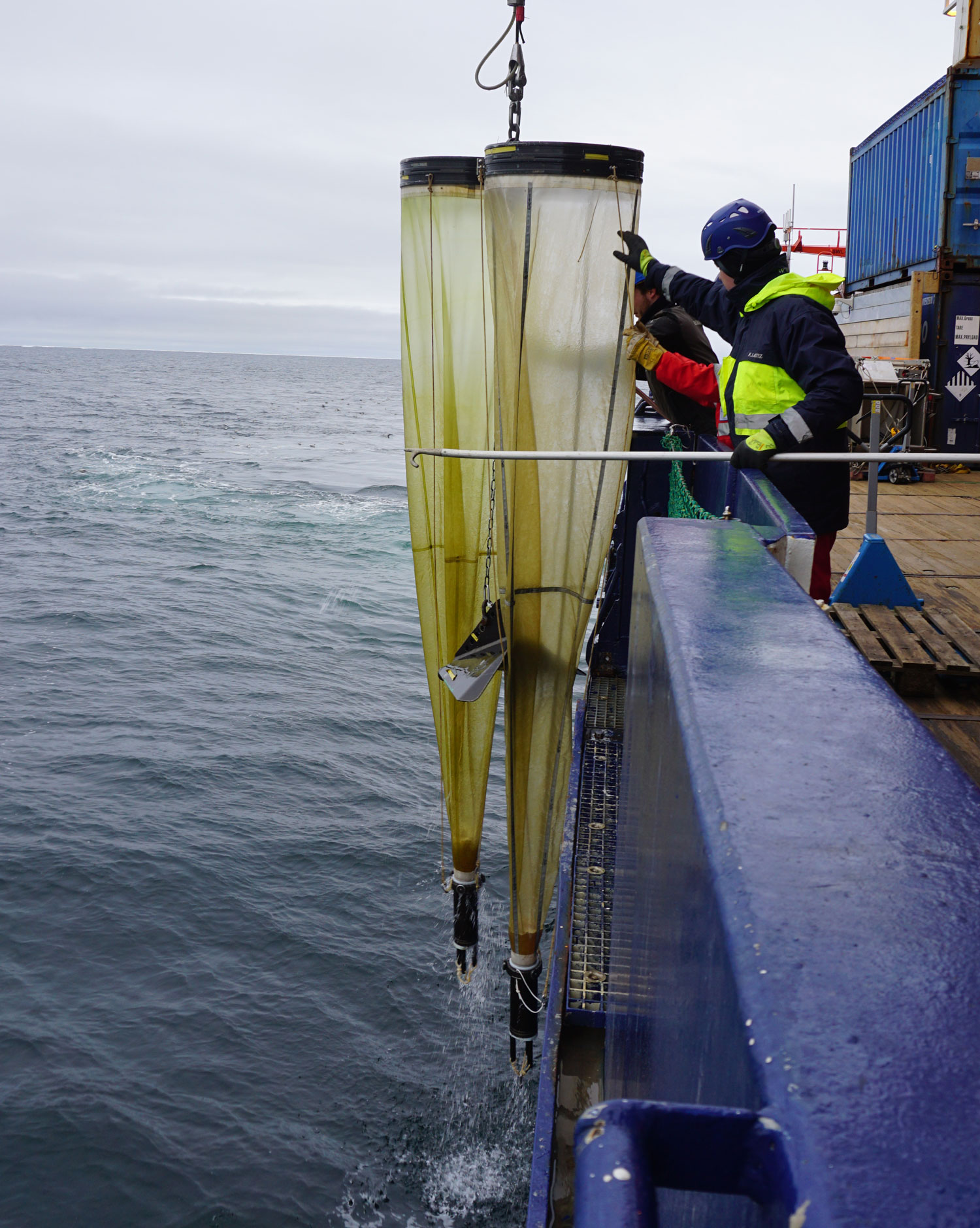 Scientists winching plankton nets out of the water